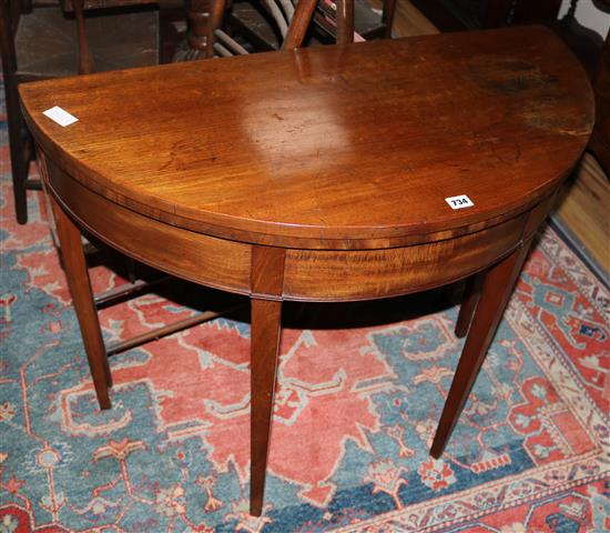 A George III mahogany demi-lune card table, W.95cms